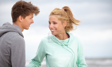 Romantic young couple on autumn beach
