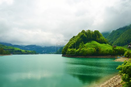 Beautiful emerald mountain lake in Switzerland