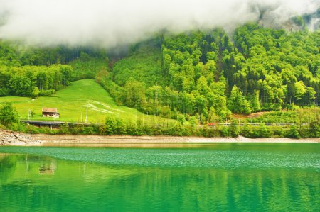 Beautiful emerald mountain lake in Switzerland