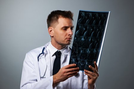 Medical doctor with MRI spinal scan