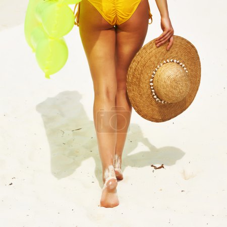 Woman with yellow inflatable raft
