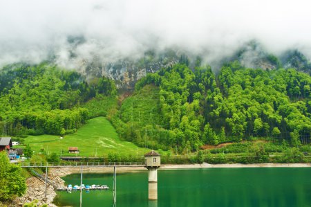 Beautiful emerald mountain lake in Switzerland