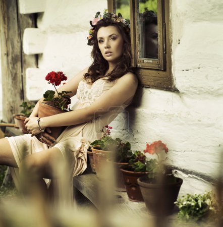 Pure brunette woman with flowers