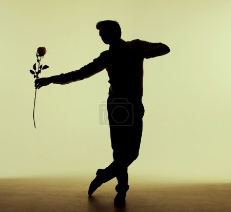 Tall man dancing with the rose
