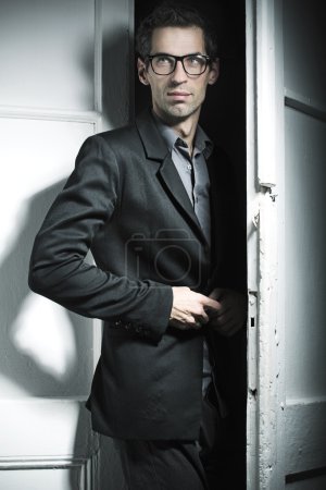 Smart model wearing black suit
