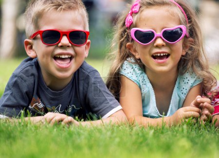 Cute small kids with fancy sunglasses