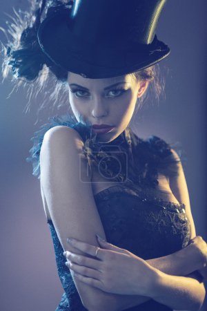 Portrait of na attractive young female model with the top hat