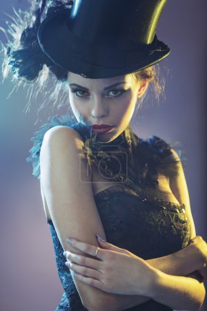 Portrait of the alluring young female model with the top hat
