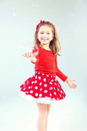 Little princess with soap bubbles