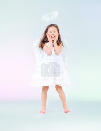 Cute little girl as an angel