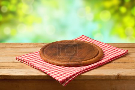 Round board on tablecloth