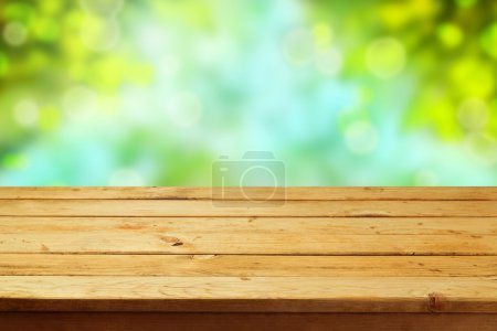 Deck table over garden bokeh background