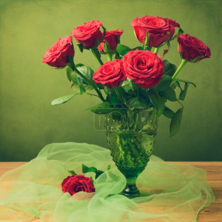 Rose flower bouquet in green glass retro vase