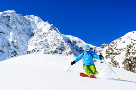Ski, Skier, Freeride in fresh powder snow - man skiing downhill