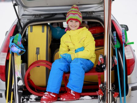 Winter, skiing, journey - girl with ski equipment
