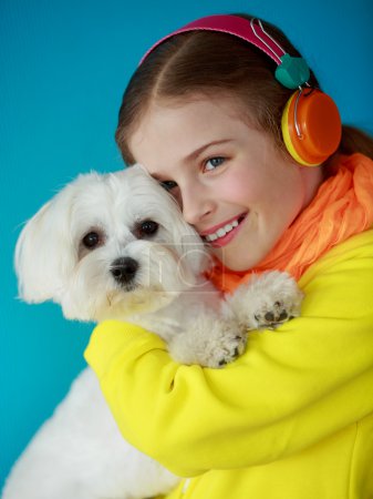 Young girl with cute puppy