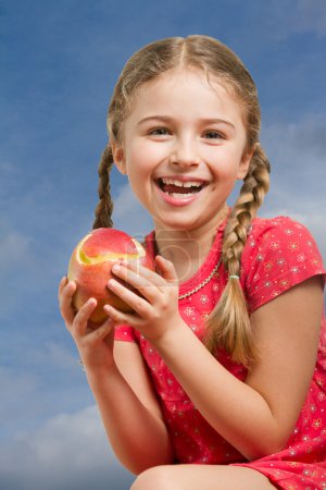 Lovely girl with red apple