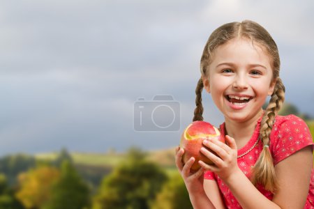 Lovely girl with red apple