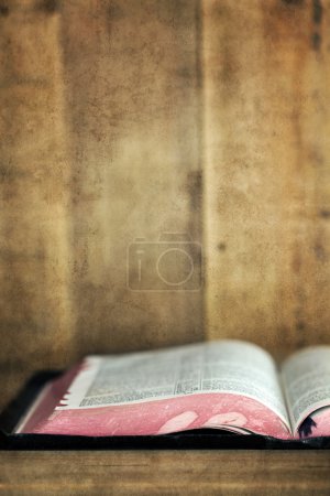 Old Bible Open on Bookshelf with Grunge Effects