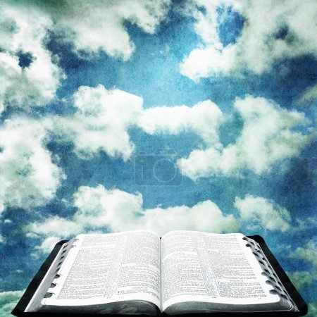 Open Bible with Grunge Sky