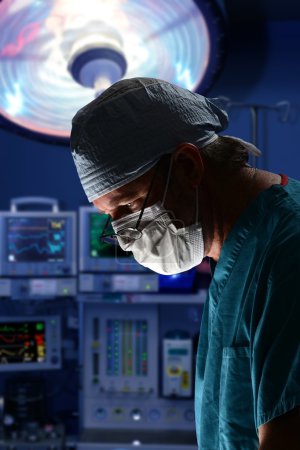Surgeon in performing an operation