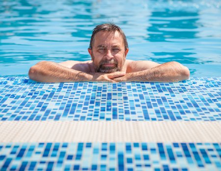Middle-aged man in a swimming pool
