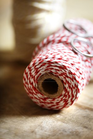 Spool of red and white twine