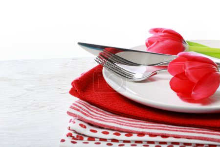 Dishware with red tulips