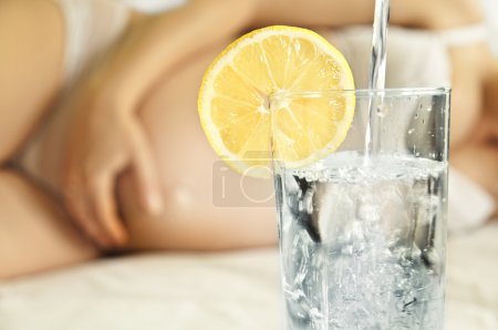 Glass of water for a pregnant woman