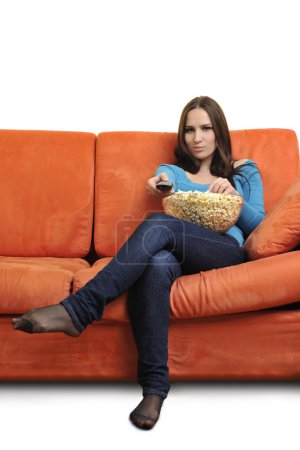 Woman eat popcorn and watching tv