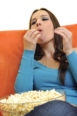 Woman eat popcorn