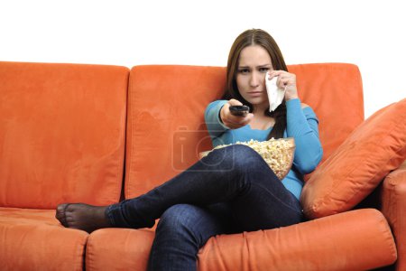 Woman eat popcorn and watching tv