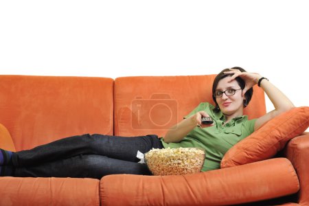 Woman with popcorn watching tv