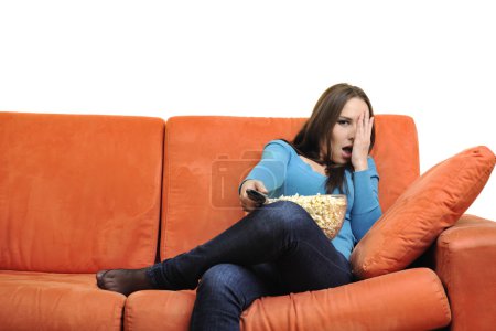 woman eat popcorn and watching tv