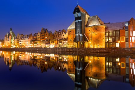 Old town of Gdansk with ancient crane at night