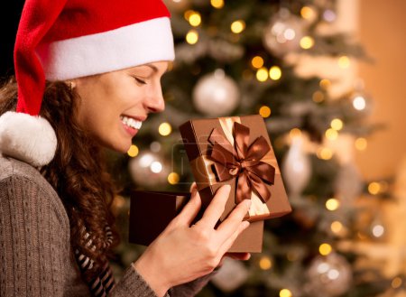 Christmas. Happy Surprised Woman opening Gift box