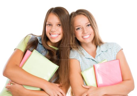 Students Portrait. Cute Attractive Teenage Girls Holding Books