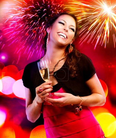 Beautiful Girl with Holiday Makeup Holding Glass of Champagne