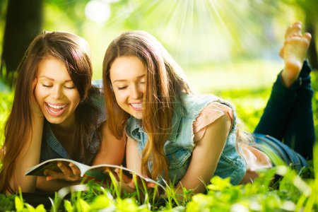 Teenage girls reading a magazine
