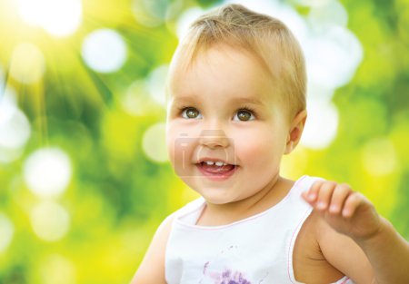 Little Baby Girl Portrait Outdoor. Smiling Cute Child