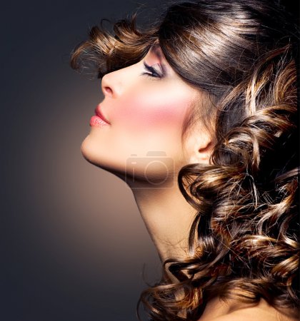 Beauty Woman Portrait. Curly Hair. Brunette Girl