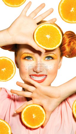 Model girl takes juicy oranges.