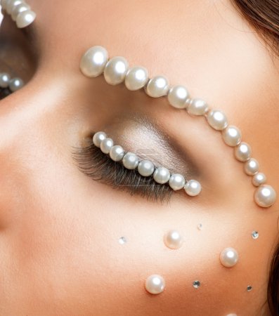 Creative Makeup With Pearls. Beautiful Young Woman Portrait
