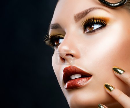 Golden Luxury Makeup. Fashion Girl Portrait