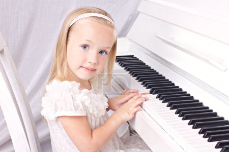 little girl at piano