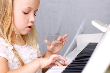 Little girl at piano