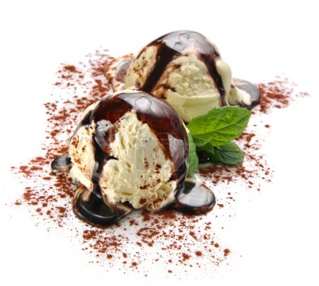Tiramisu ice cream scoops with chocolate topping and cocoa