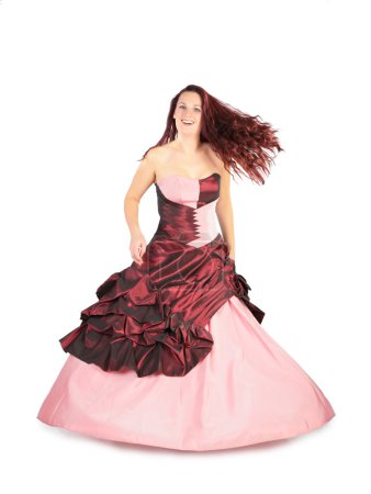 Woman in a long pink dress with a flying hair