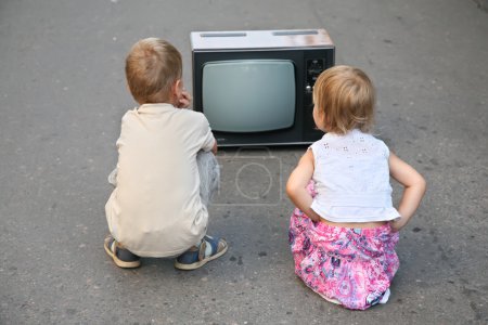 Children on the road in the old television set