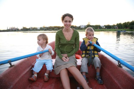 Mother and child in the boat in the lake